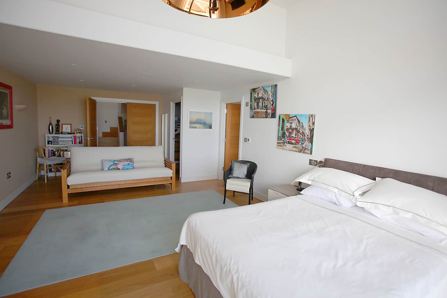 Bedroom one, high ceilings and a sea view